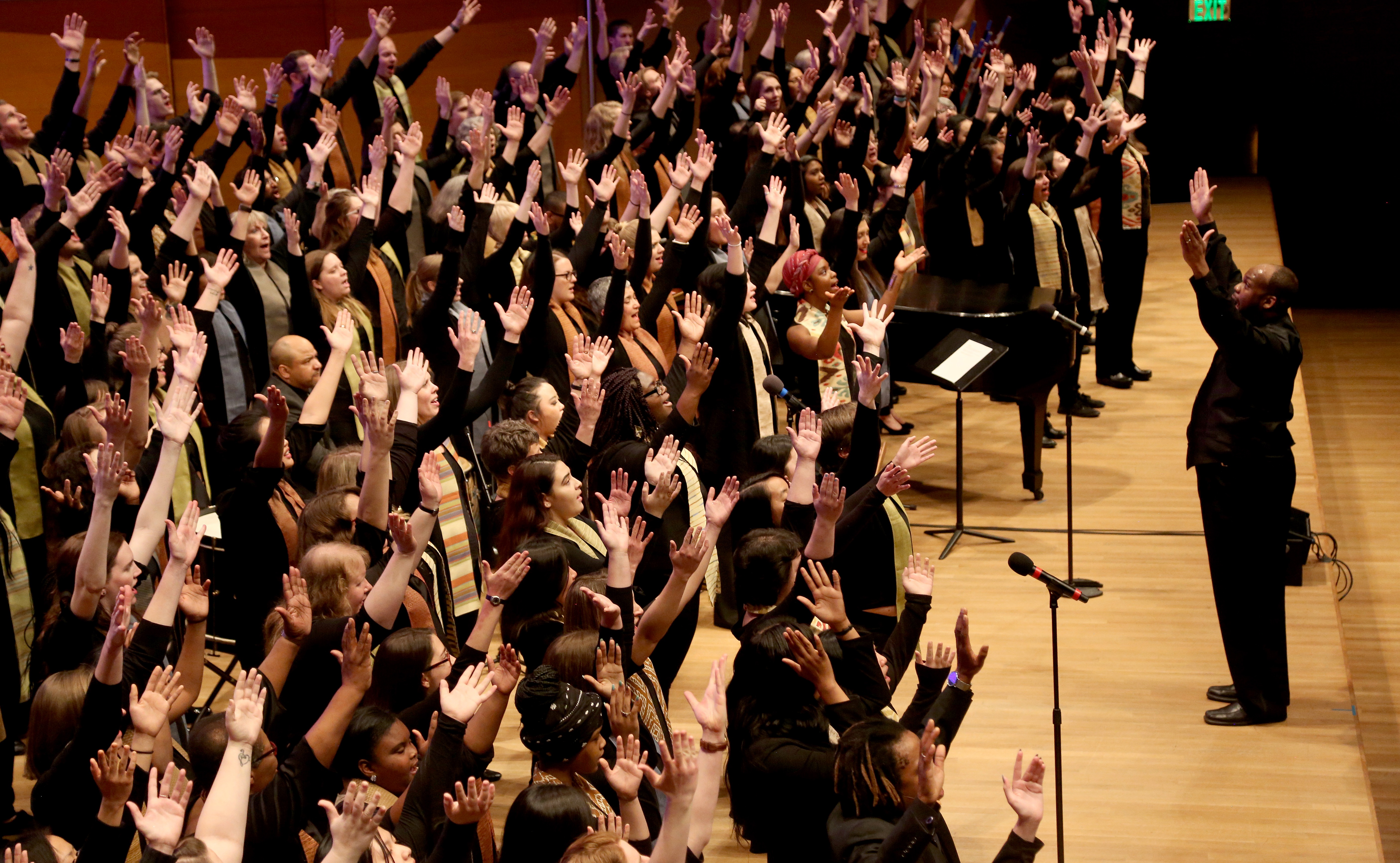 Singers with their hands in there air, Photo Credit: Kyndell Harkness