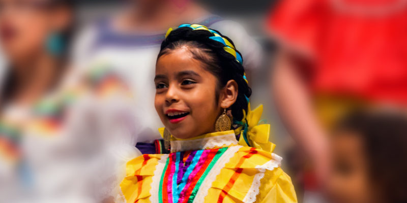 Singing girl wearing Mexican dress