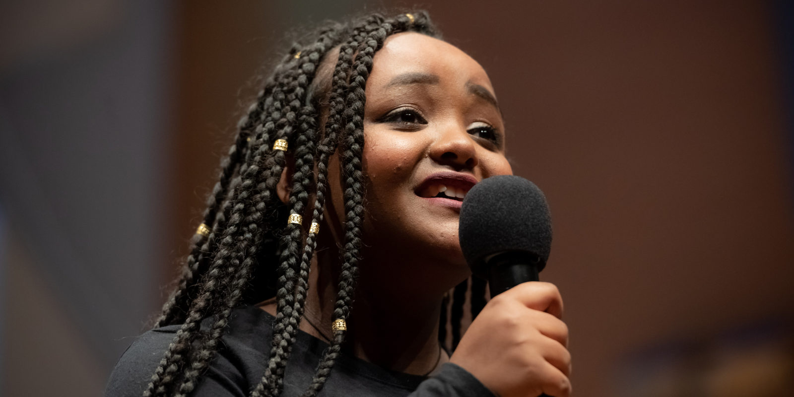 African American young woman singing