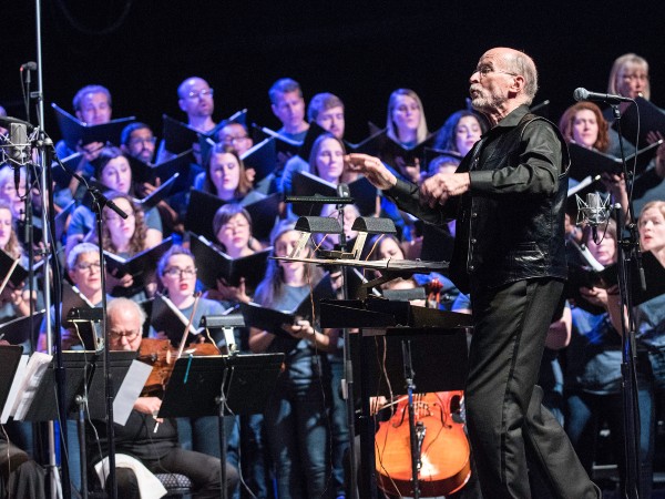 Conductor in front of singers and instrumentalists