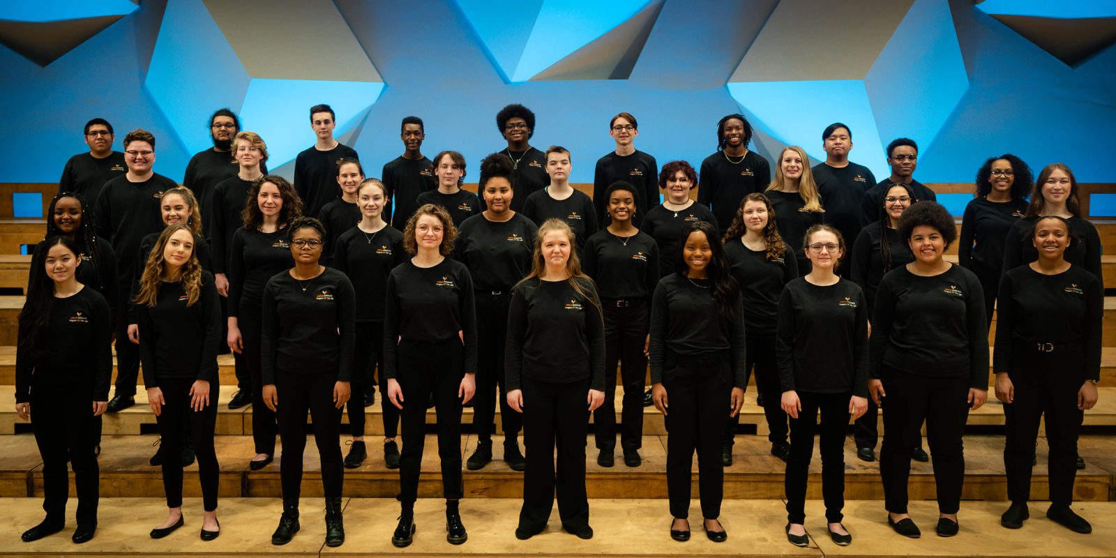 Singers posing on stage