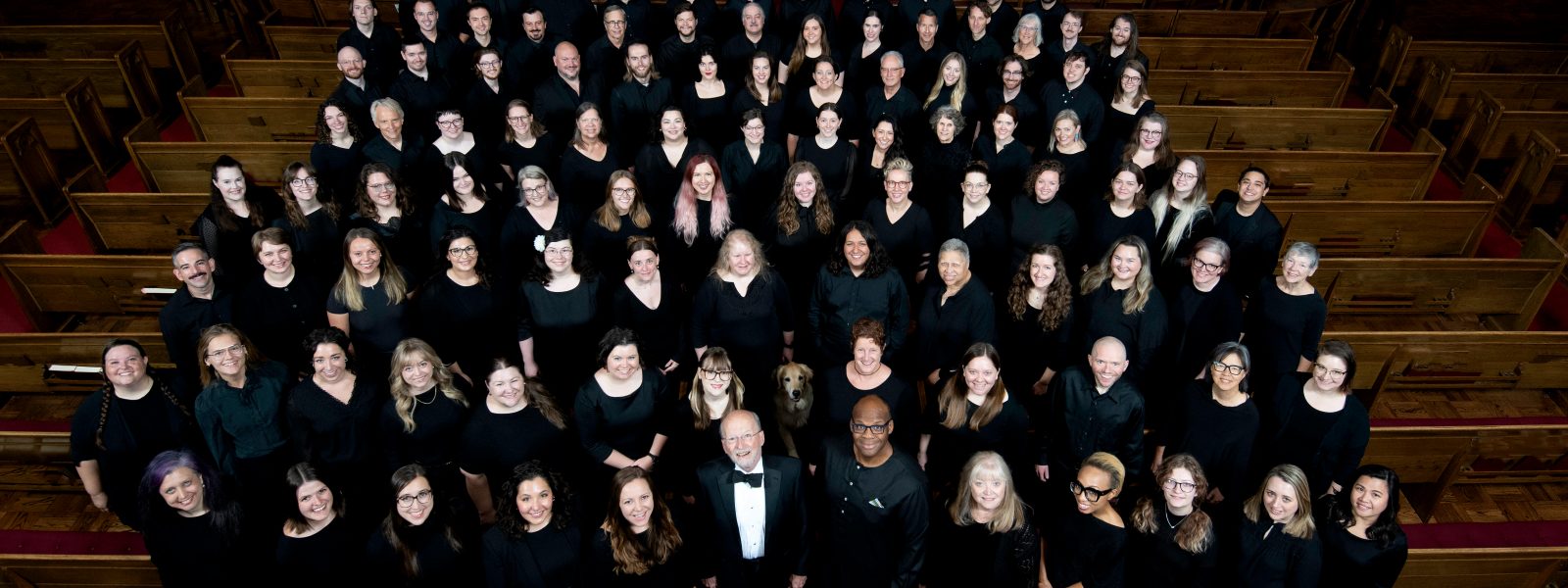 VocalEssence Chorus members wearing black pose for a photo. Photo Credit: Bruce Silcox