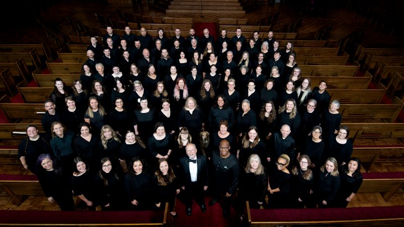 VocalEssence Chorus members wearing black pose for a photo. Photo Credit: Bruce Silcox