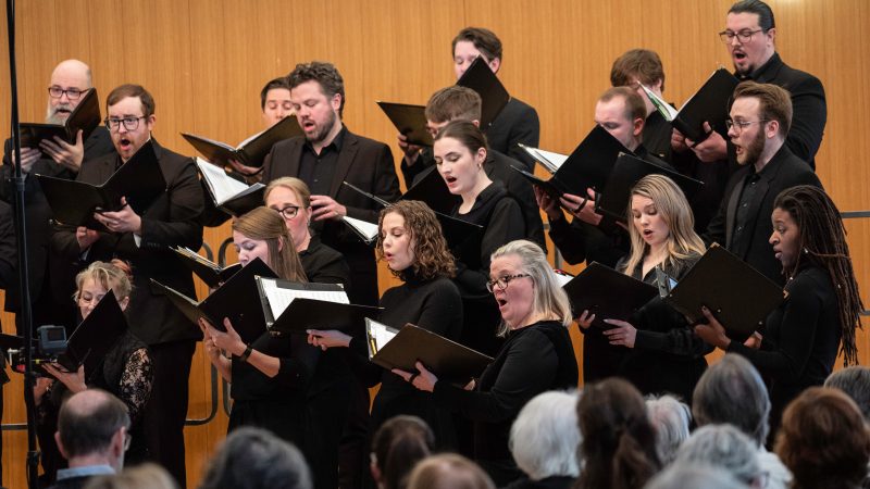 VocalEssence Ensemble Singers wearing black perform. Photo Credit: Bruce Silcox