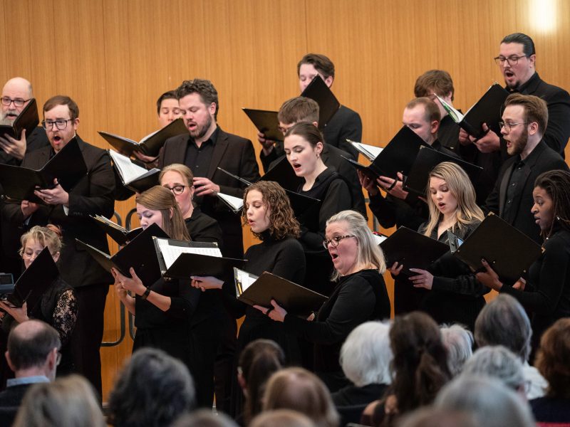 VocalEssence Ensemble Singers wearing black perform. Photo Credit: Bruce Silcox