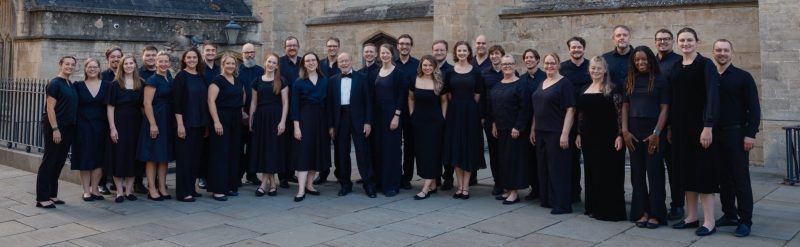VocalEssence Ensemble Singers wearing black pose for a photo. Photo Credit: Ethan Kellum Johnson