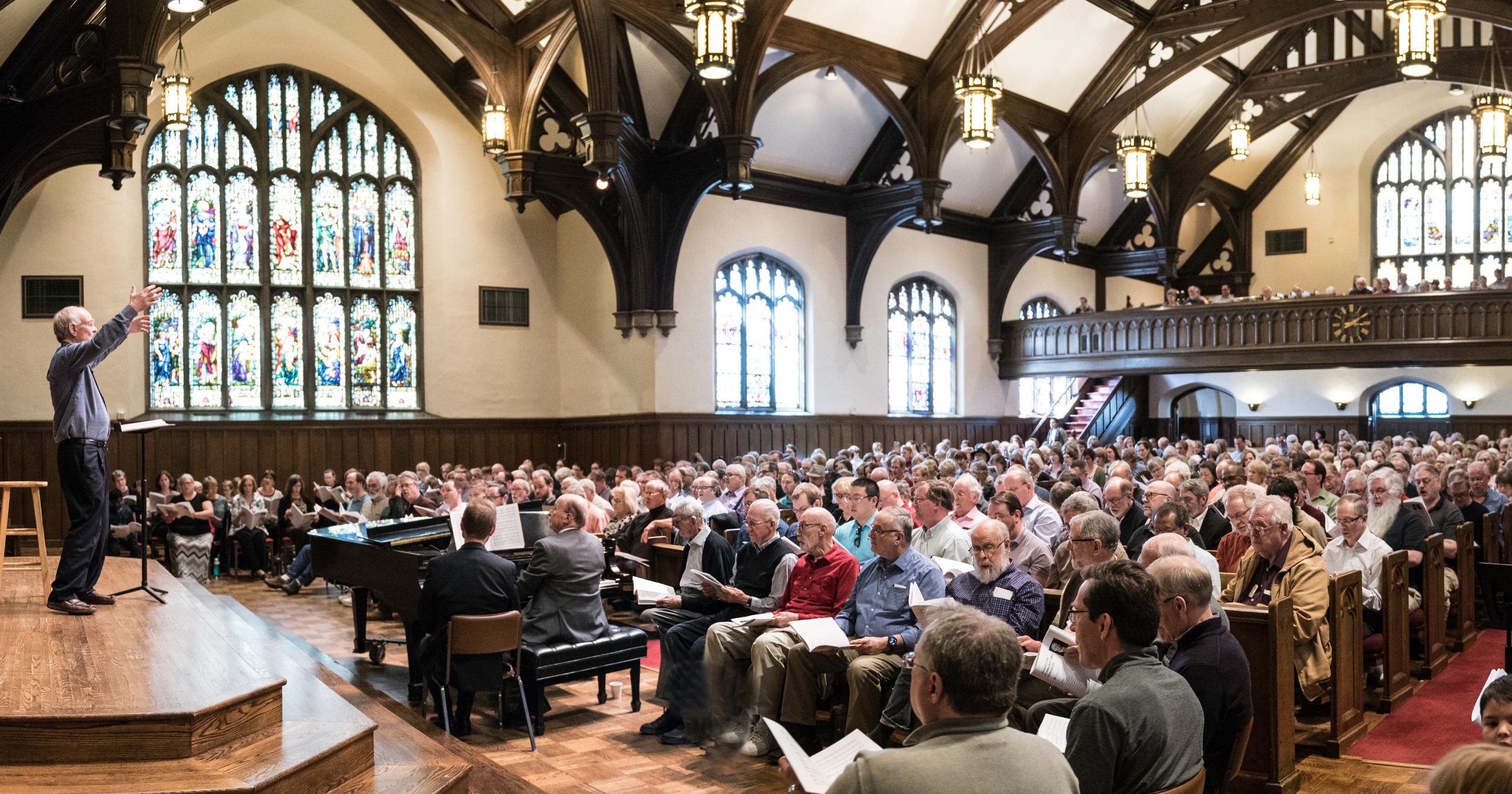 Community members singing the music of Sir John Rutter conducted by the composer himself. Photo credit: Bruce Silcox