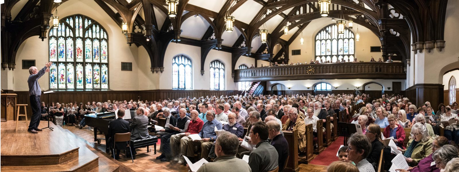 Community members singing the music of Sir John Rutter conducted by the composer himself. Photo credit: Bruce Silcox
