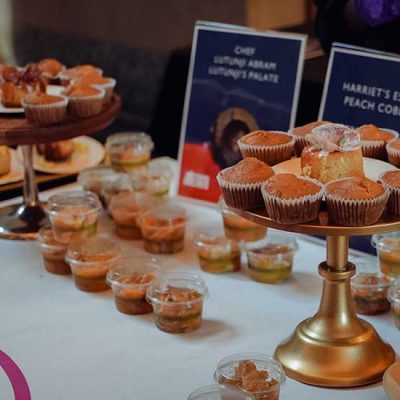 A table displays pastries and baked goods from a local Black chef at the 2025 Feeding Our Souls: The Essence of Juneteenth Joy.